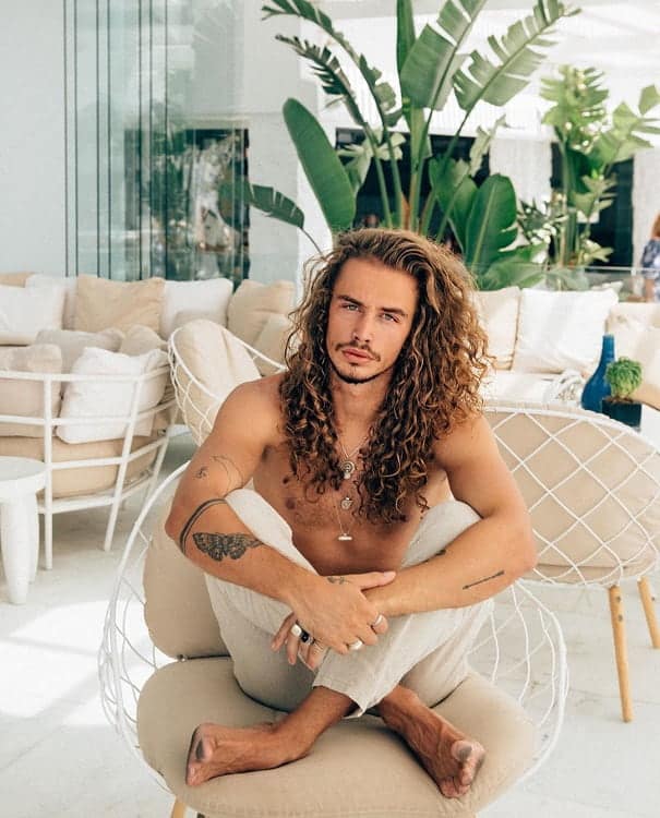 long curly hairstyle by male model