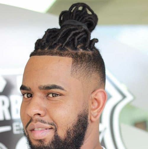 Fade on side with Dreadlock Bun