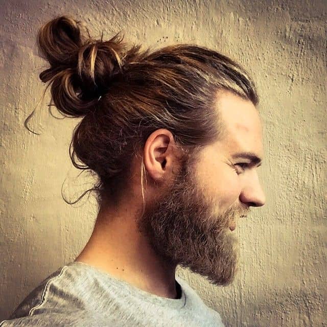 man bun hairstyle for big ears men 