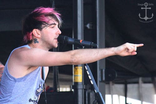 Image of Alex Gaskarth with pink streaked hair.