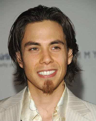 Photo of Apolo Anton Ohno medium length hairstyle.