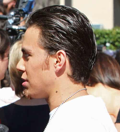 Image of Apolo Anton Ohno slick back hairstyle from side view.