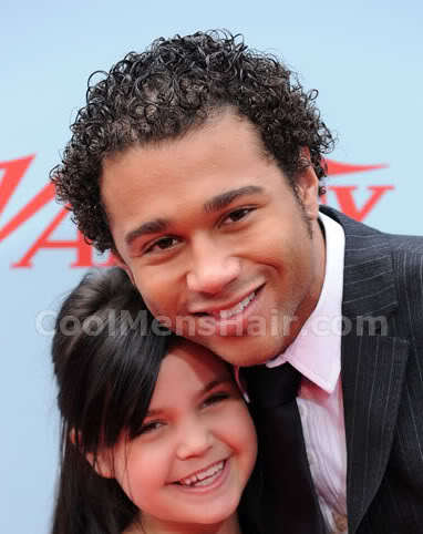 Image of Corbin Bleu short curly hairstyle for African American men.