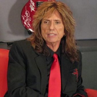 Photo of David Coverdale long hairstyle.