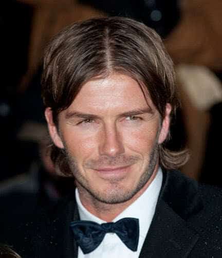 David Beckham center part hairstyle.