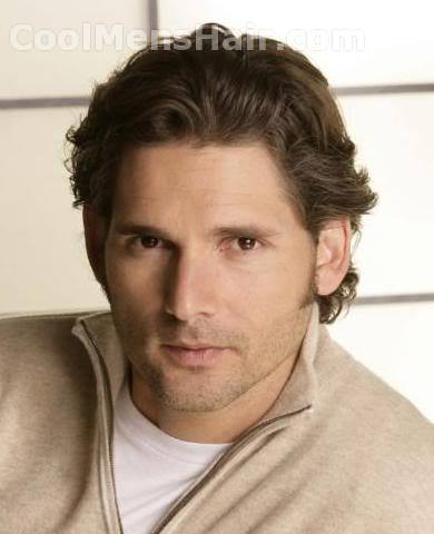 Picture of Eric Bana curly swept back hair.