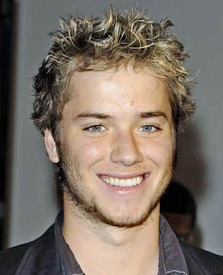 Photo of Jeremy Sumpter short textured wavy hairstyle.