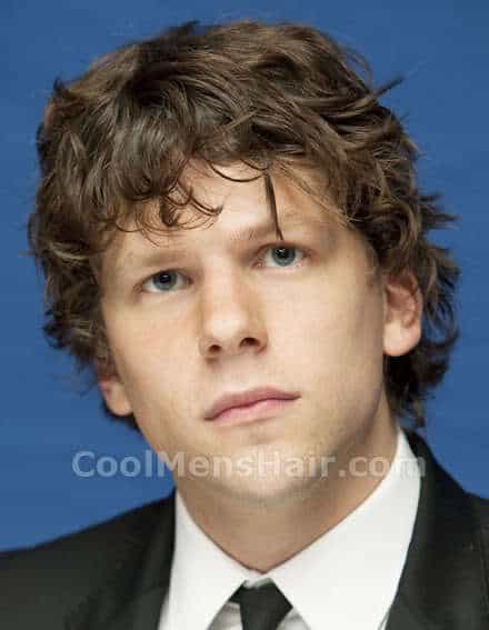 Photo of Jessie Eisenberg curly hairstyle with bangs.