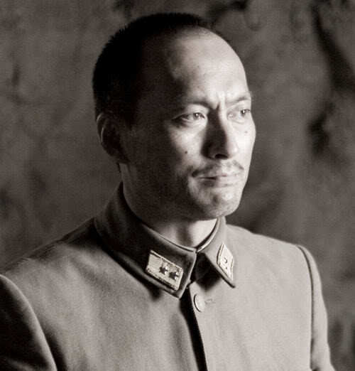 Photo of Ken Watanabe military hairstyle.