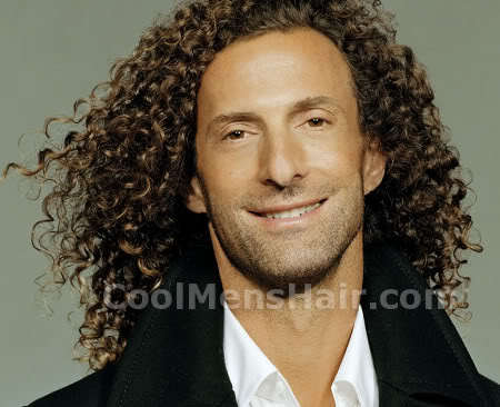 Photo of Kenny G long curly hairstyle.