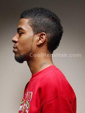 Image of Kid Cudi short curly mohawk hair for black men.