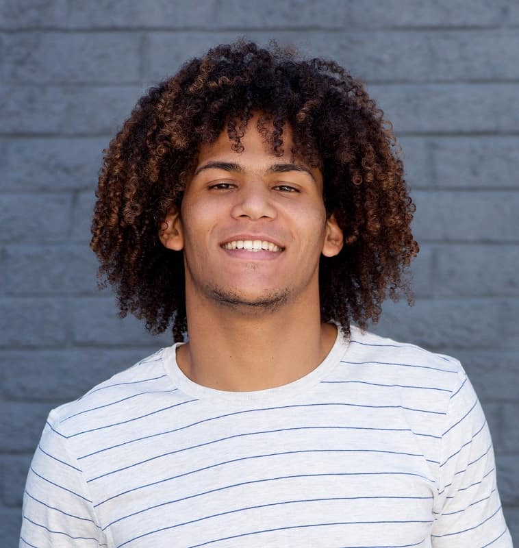curly ombre hairstyle for guys with light skin tone