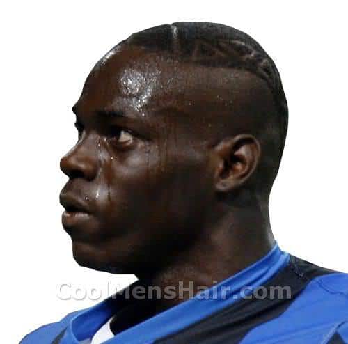 Pic of Mario Balotelli short mohawk hair with tattoo.