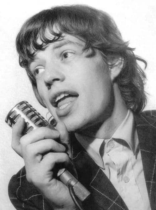 Picture of Mick Jagger hairstyle curly ends.