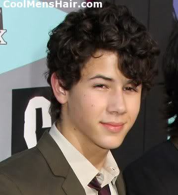 Photo of Nick Jonas curly hairstyle. 