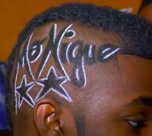 Photo of Roscoe Dash Mohawk hairstyle with glitter tattoo. 