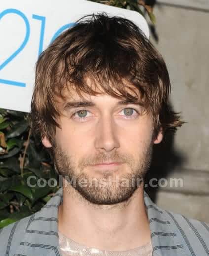 Photo of Ryan Eggold messy shaggy hair.