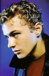 Justin Timberlake curly hair with highlighted tips