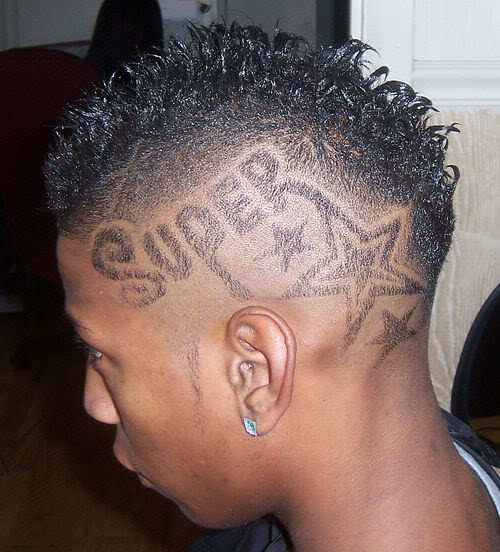 Word Super tattooed on head.