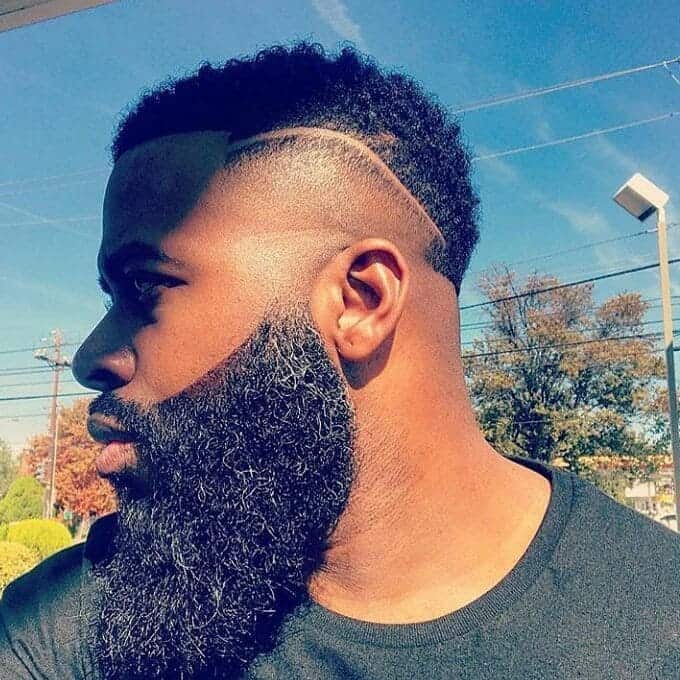 temp fade haircut with part and curls for men