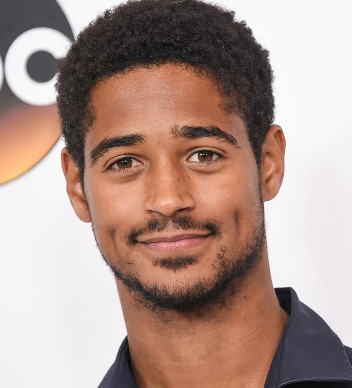 actor with afro curls - Alfred Enoch