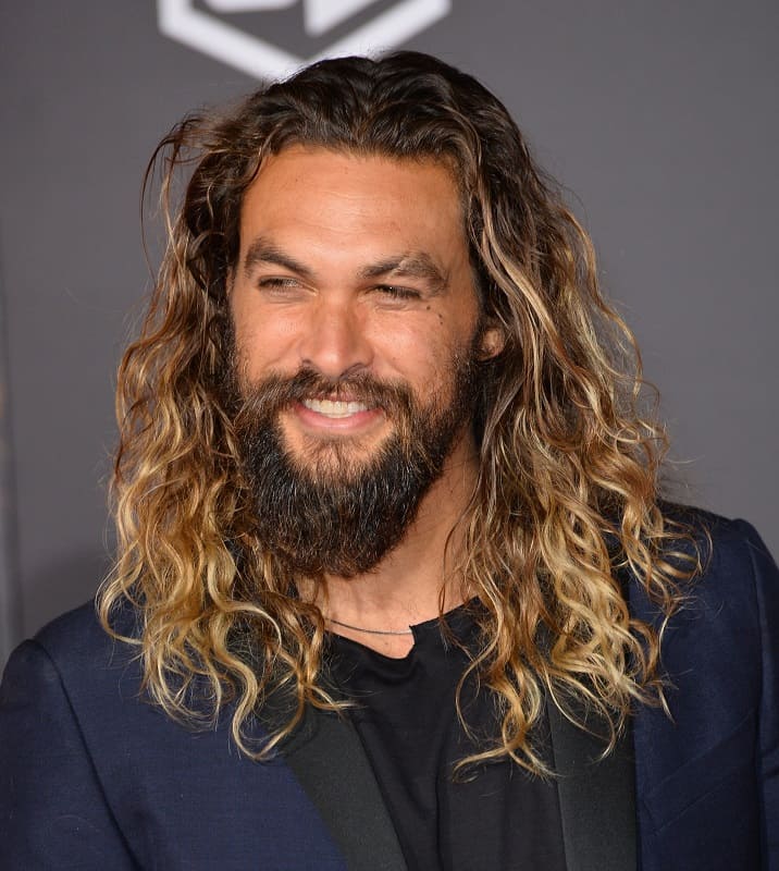 actor with loose curly hair - Jason Momoa