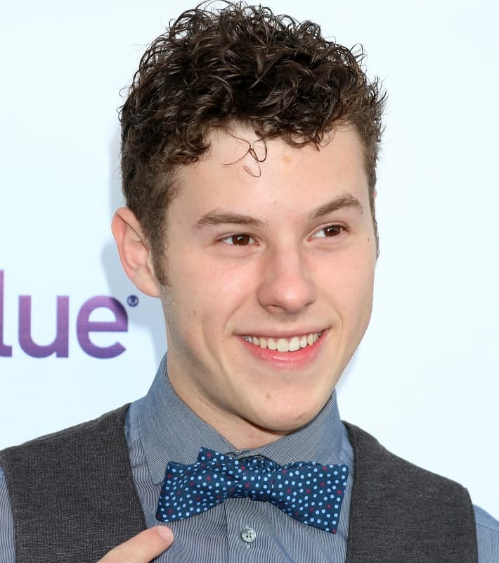 actor with short curls - Nolan Gould