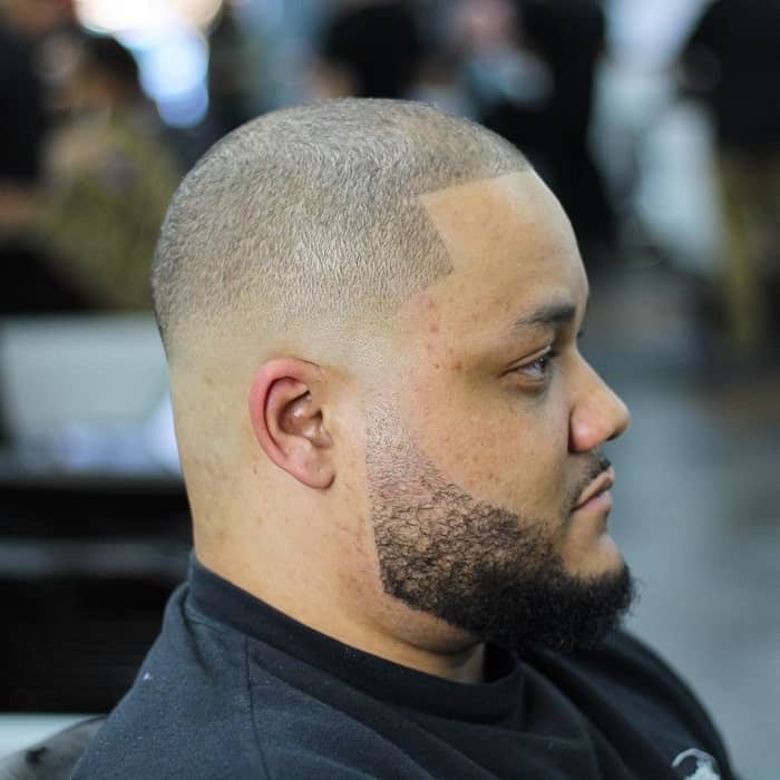 guy with bald fade and beard