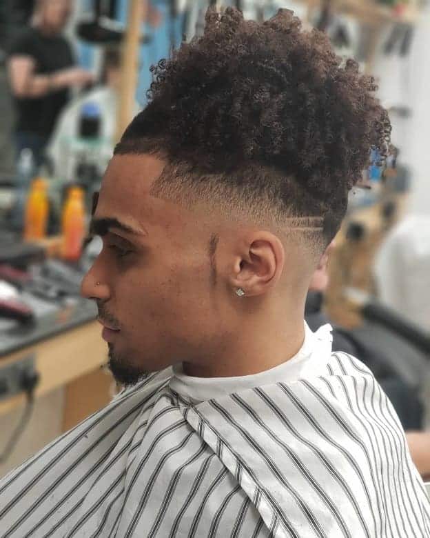 Curly Top Knot with Bald Taper Fade