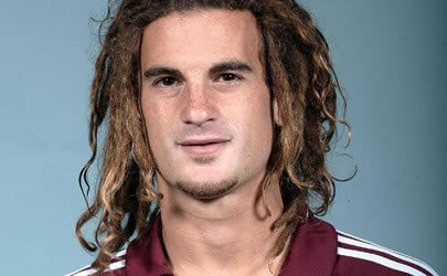 Photo of Kyle Beckerman dreads hairstyle.