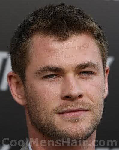Photo of Chris Hemsworth short textured hairstyle. 