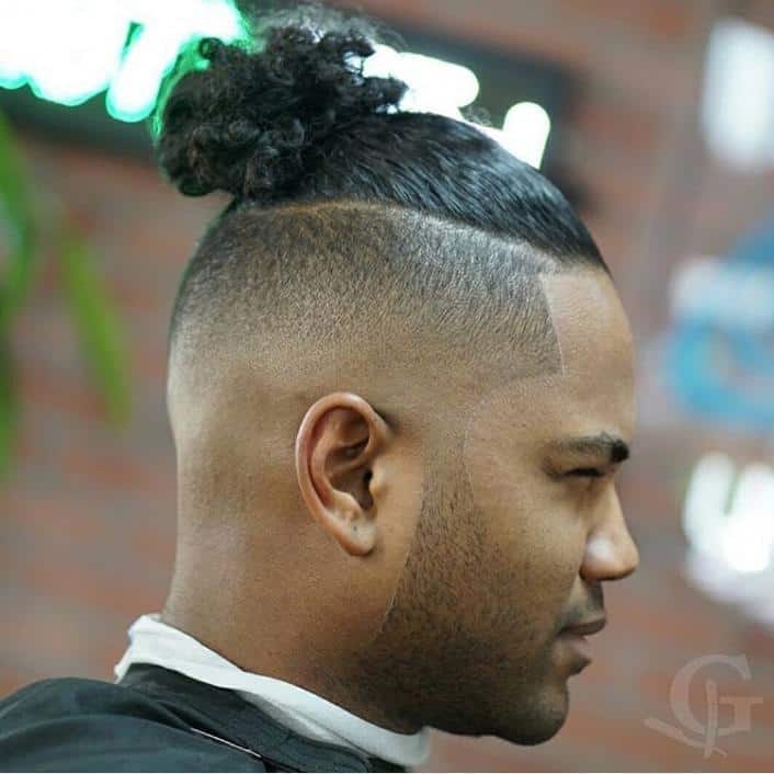 black men bun on trimmed head