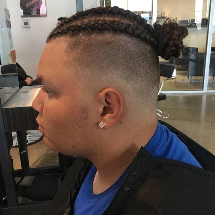 cornrow man bun with shaved sides