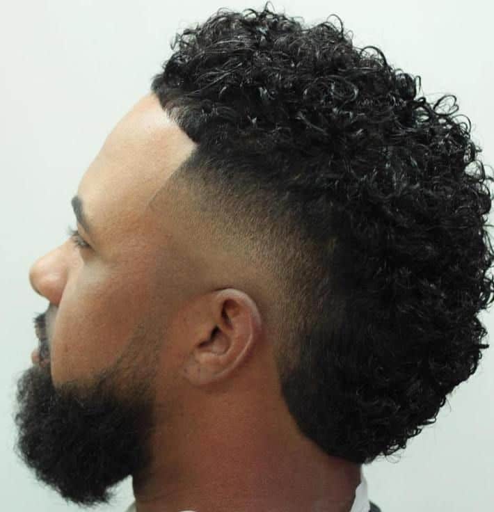 curly faux hawk with low fade