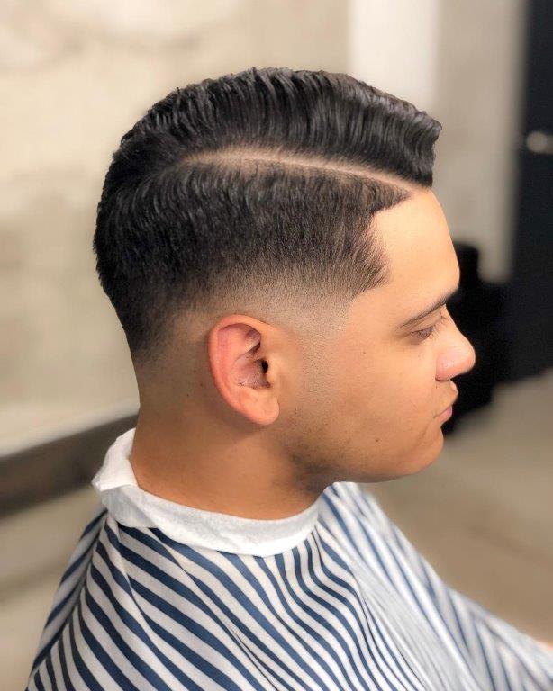 guy with curly comb over haircut