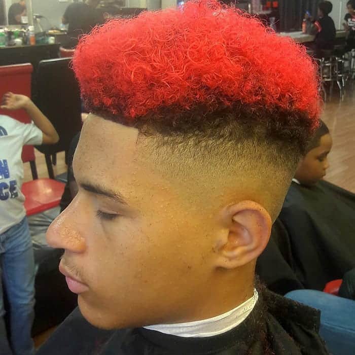 curly high top fade with red hair