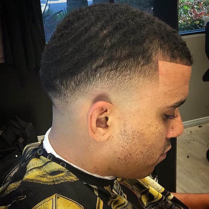 guy with drop fade haircut and waves
