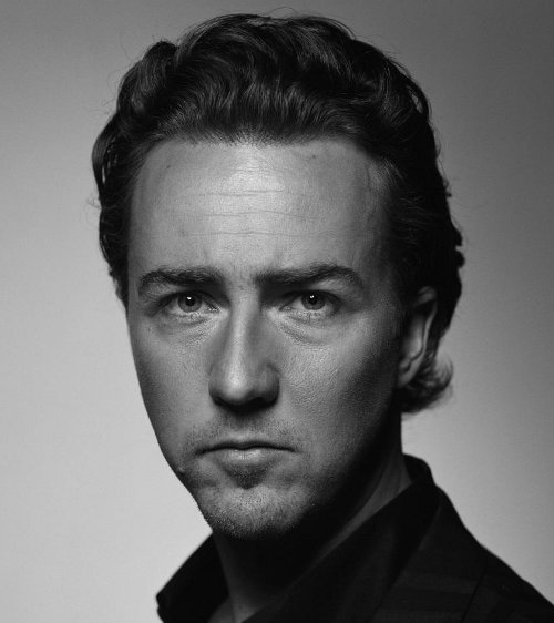 Photo of Edward Norton combed back hair.