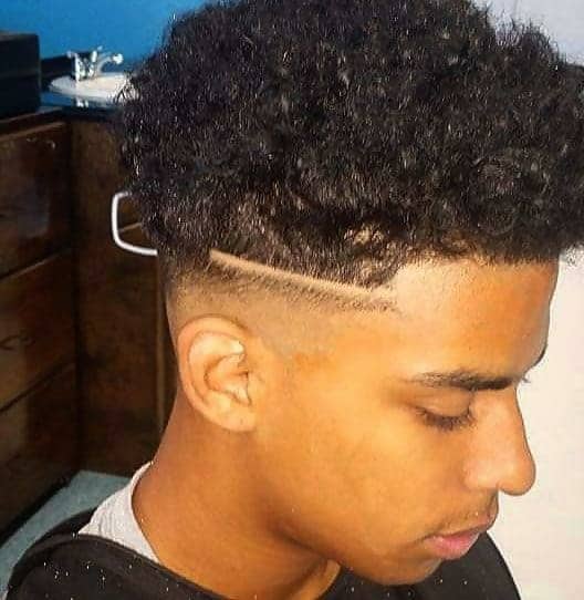 black boy with temple fade and curls