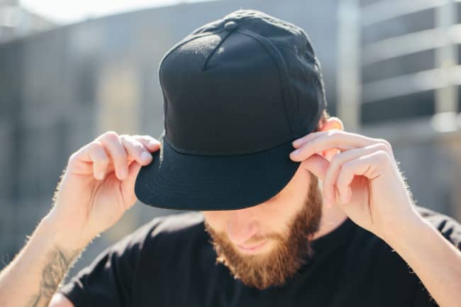 man with bad haircut with hat