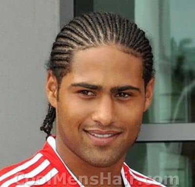 Photo of Glen Johnson with cornrows hair.