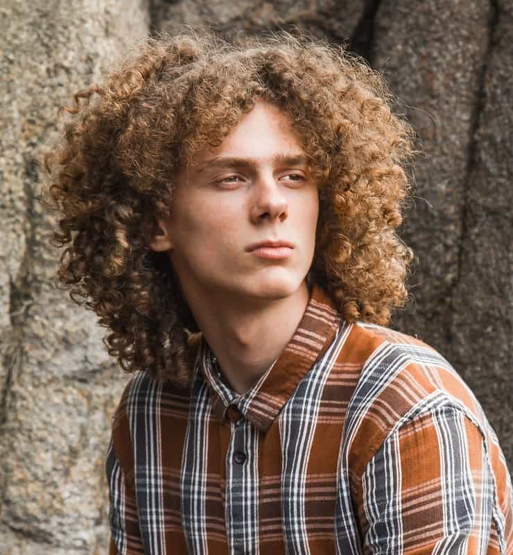 guy with curly mid parted hair