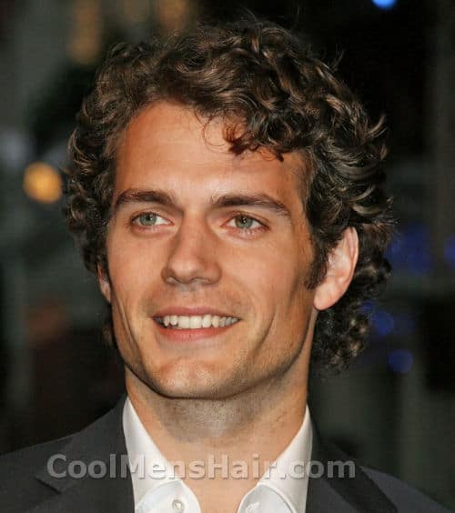 Picture of Henry Cavill curly hairstyle.