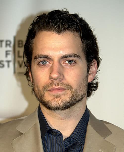 Photo of Henry Cavill combed back hairstyle.