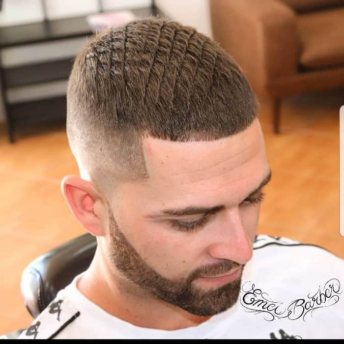 short patterned hair with high bald fade