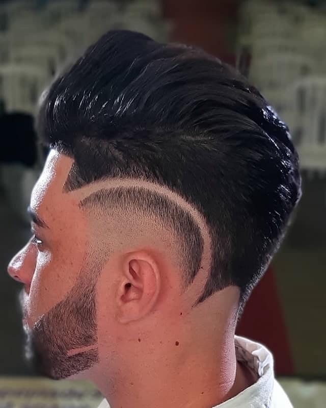 high taper fade with design 