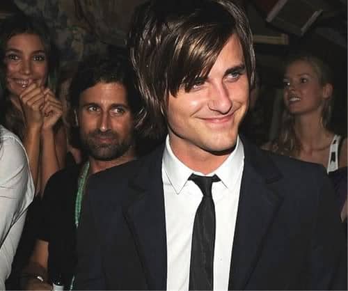 Photo of Jared Followill razored hairstyle with bangs. 