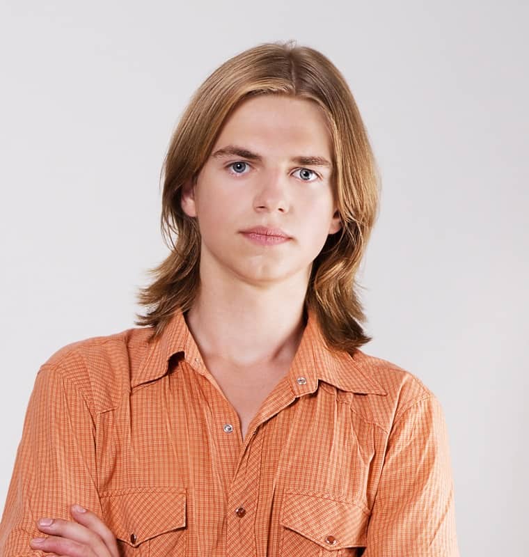 layered haircut with middle part for men