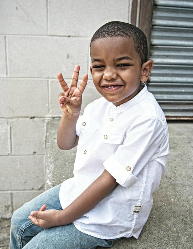 black boy with short cropped curly hair