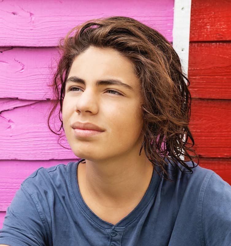 messy long hairstyle for teen boys